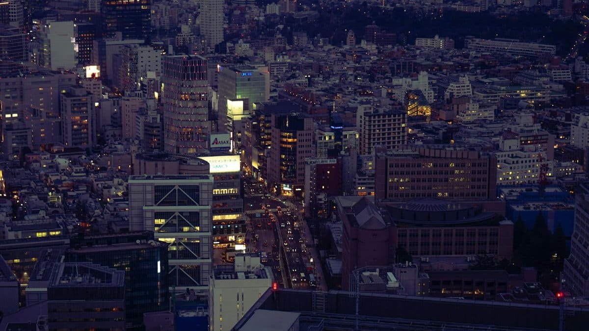 Captivating aerial view of Shibuya City, Tokyo at night showcasing the bustling urban landscape and vibrant skyline.