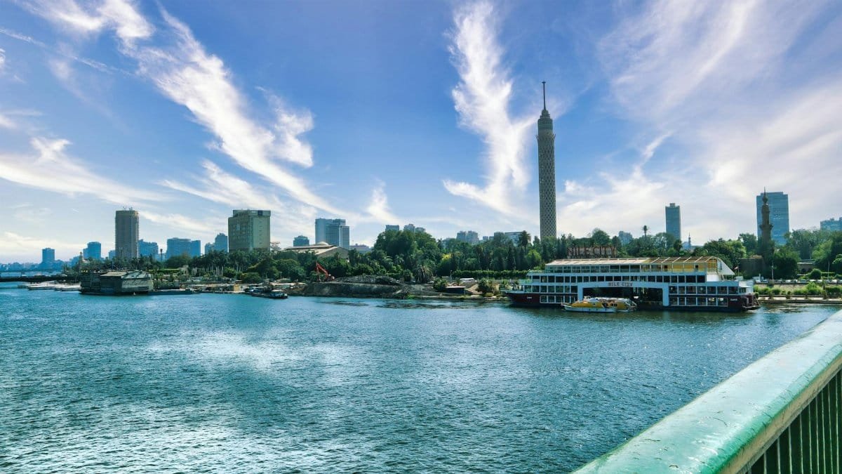 Stunning daytime view of Cairo skyline featuring the Nile River and Cairo Tower.