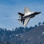 F-35 Lightning II jet captured in flight over scenic Kernville mountains, California.