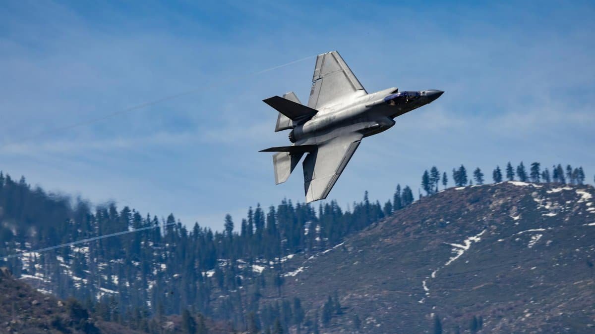 F-35 Lightning II jet captured in flight over scenic Kernville mountains, California.