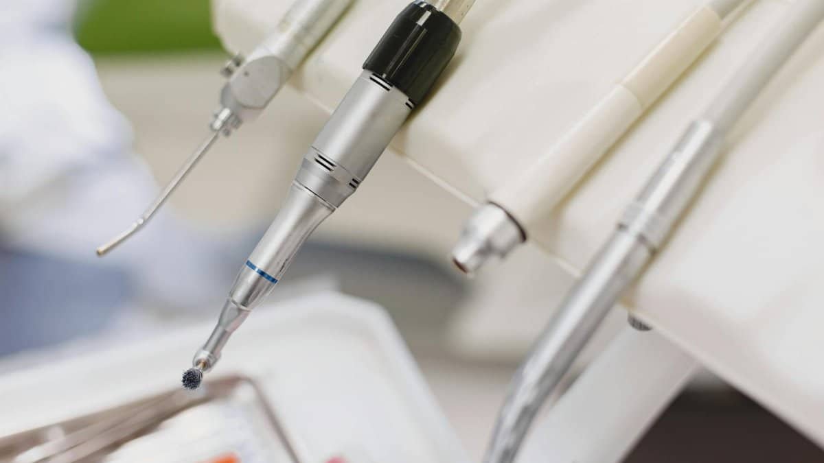Detailed image of various dental instruments arranged in a dental clinic setting.