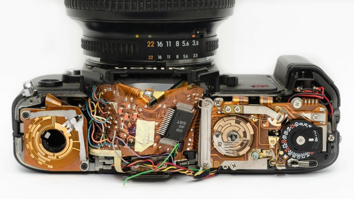 Detailed view of an exposed camera's internal circuitry and electronics components.