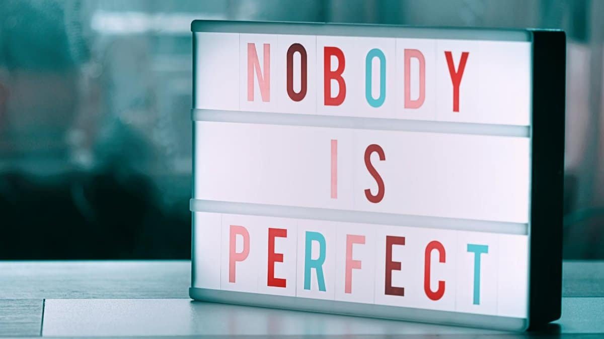 Close-up of a light box displaying 'Nobody is Perfect' inspiring self-acceptance.