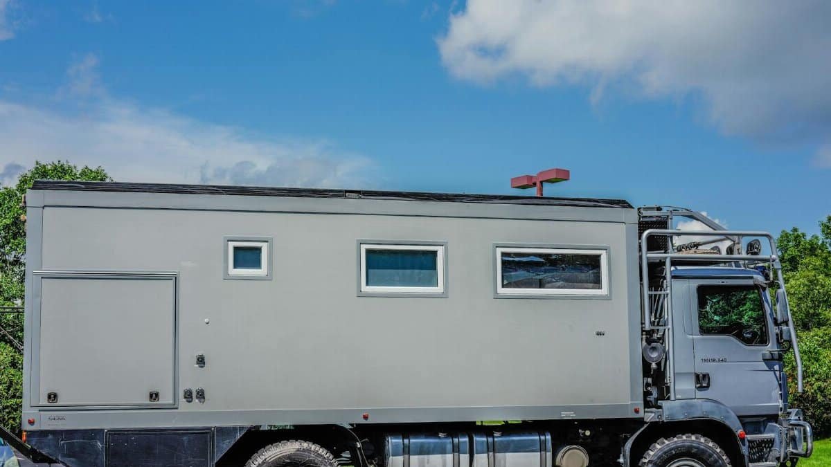 A rugged expedition vehicle parked outdoors, perfect for off-road adventures.