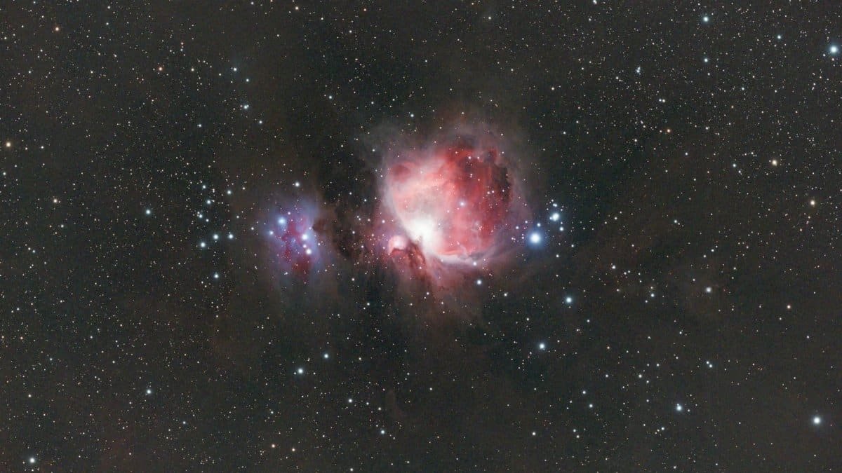 A breathtaking photograph of the Orion Nebula (M42) surrounded by stars, showcasing the beauty of deep space.