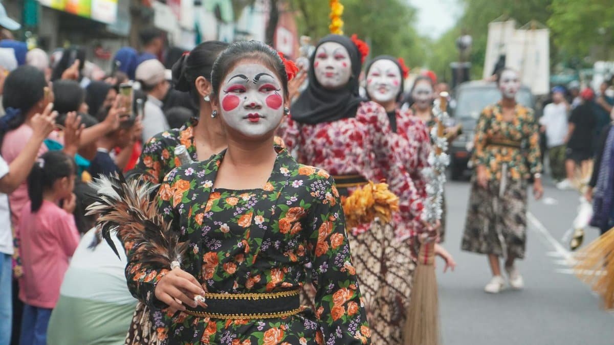 Colorful traditional parade in Yogyakarta, featuring vibrant costumes and cultural performances.