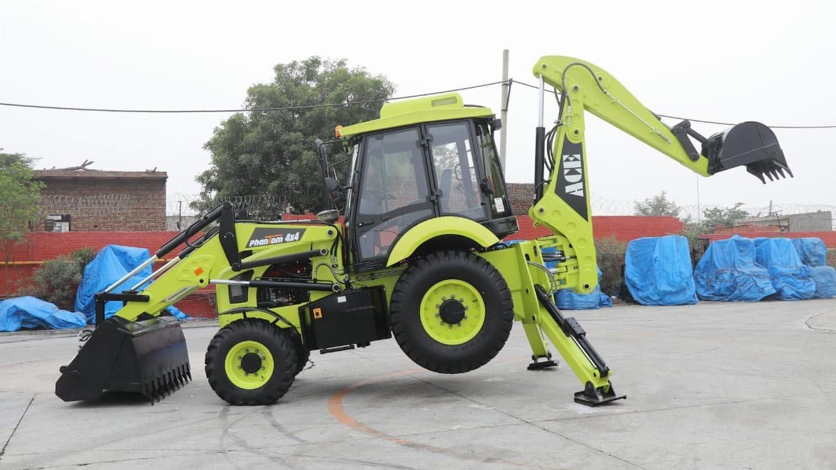 A vibrant ACE Phantom 4x4 backhoe loader is showcased in an outdoor setting in Faridabad, India.