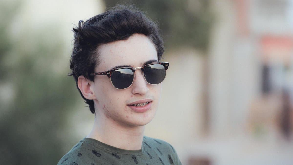 Casual portrait of a teenage boy wearing sunglasses in Tataouine, Tunisia.