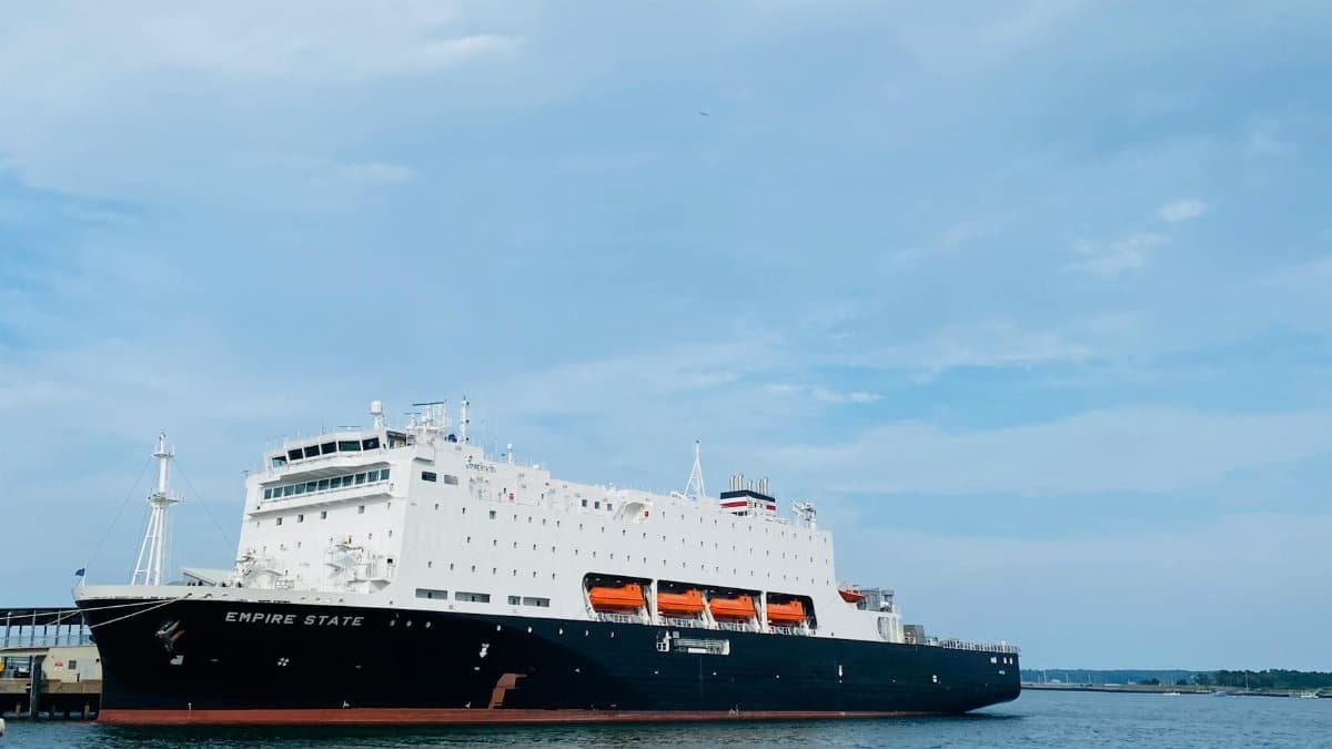 The Empire State training vessel docked in Portland, ME, under clear skies.