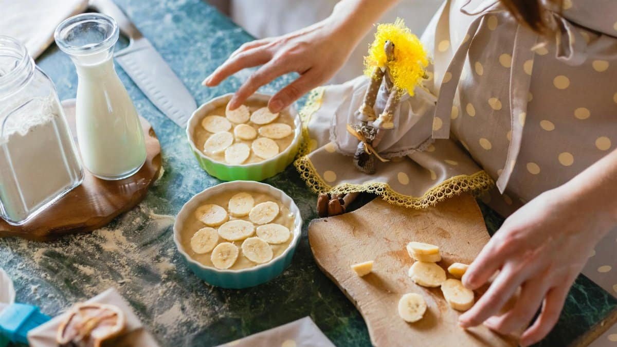 Close-up of homemade banana pie preparation with milk and flour.