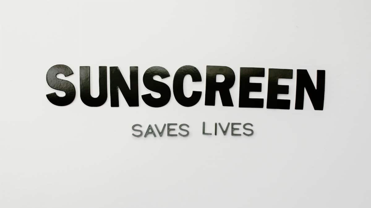 Emphasizing the importance of sunscreen with 'Sunscreen Saves Lives' text.
