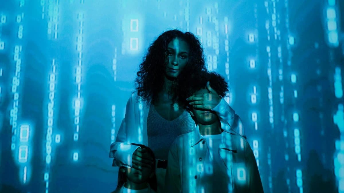 A family stands in digital blue light, symbolizing online privacy and security.