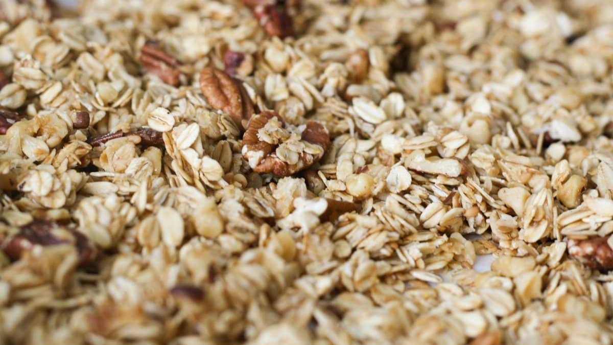 Close-up of homemade granola with crunchy oats and pecans, perfect for a healthy snack.