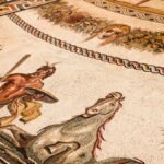 Intricate Roman mosaic featuring mythological figures and designs, showcasing ancient artistry.
