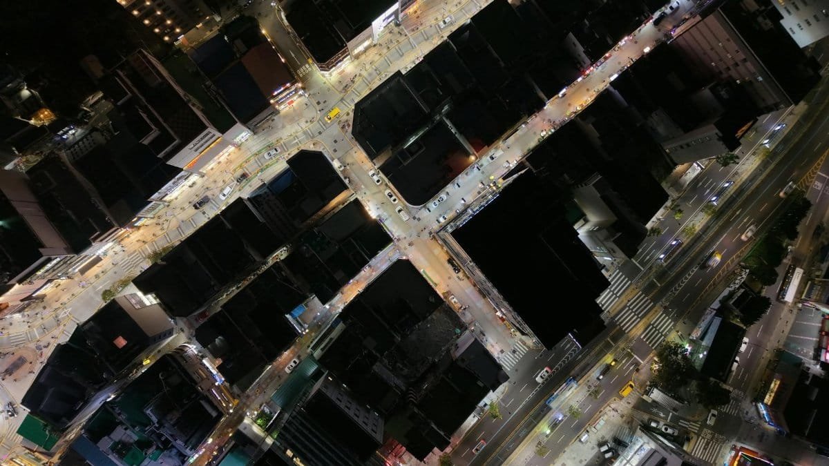 A captivating aerial night view of bustling city streets in Busan, South Korea.