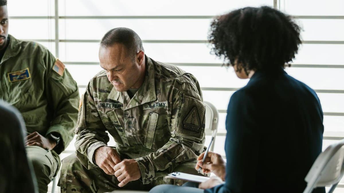A therapy session for military veterans focusing on mental health and PTSD support.
