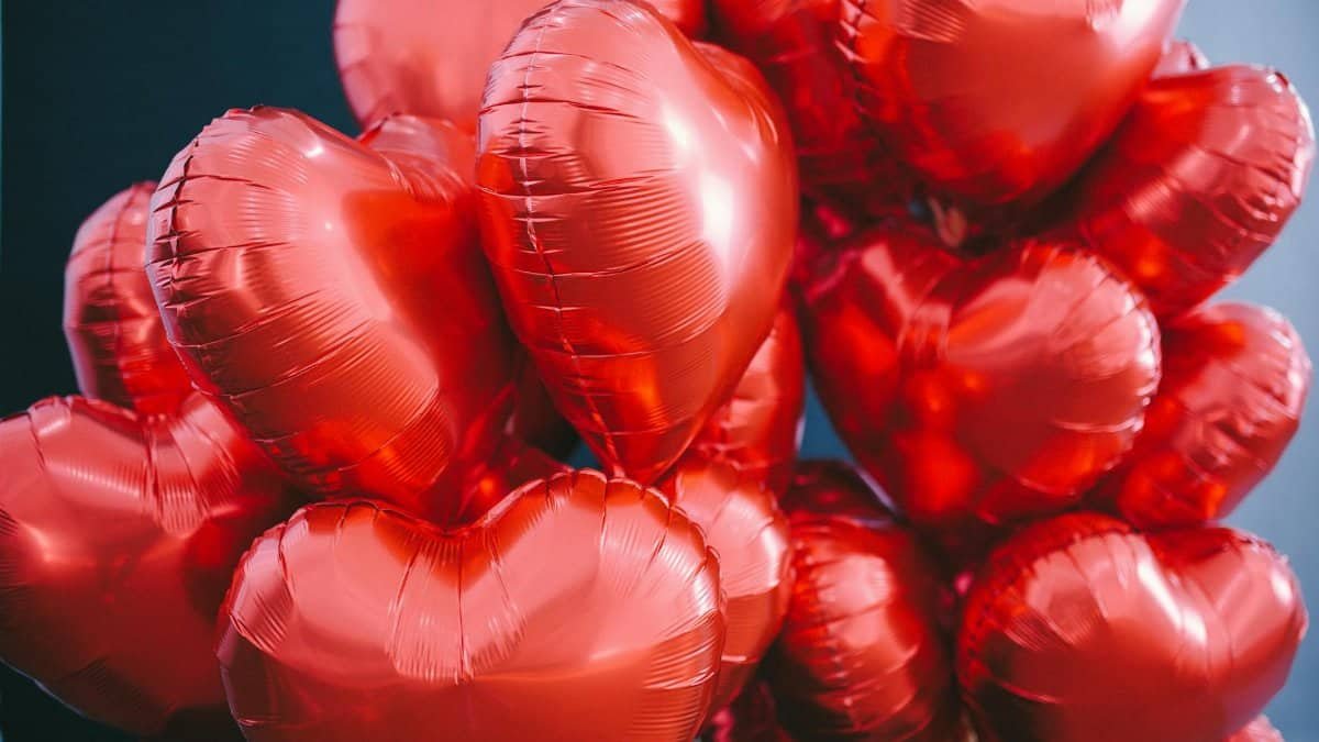 Vibrant red heart-shaped balloons, perfect for Valentine's Day or romantic celebrations.