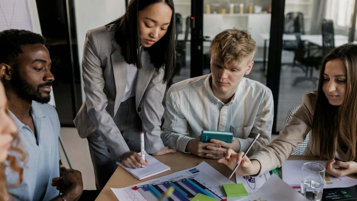Young professionals engaged in a strategic planning session, showcasing teamwork and collaboration.