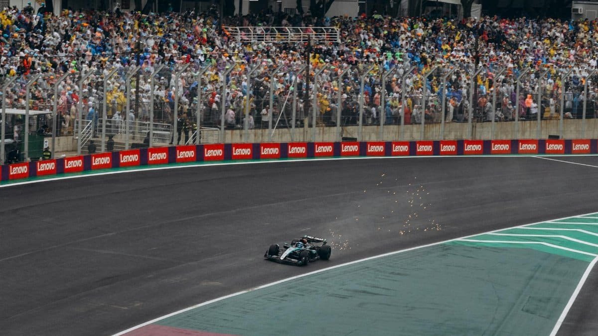 High-adrenaline moment captured during a Formula 1 race with a packed audience.