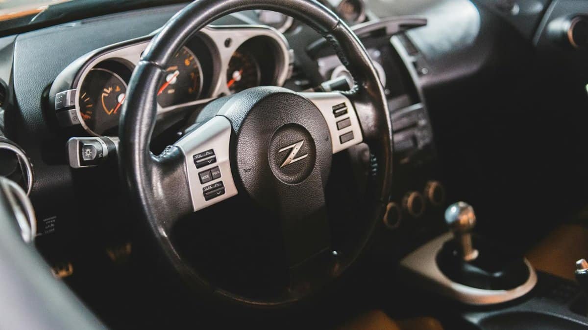 Explore the luxurious interior of a high-performance sports car with leather details and advanced features.