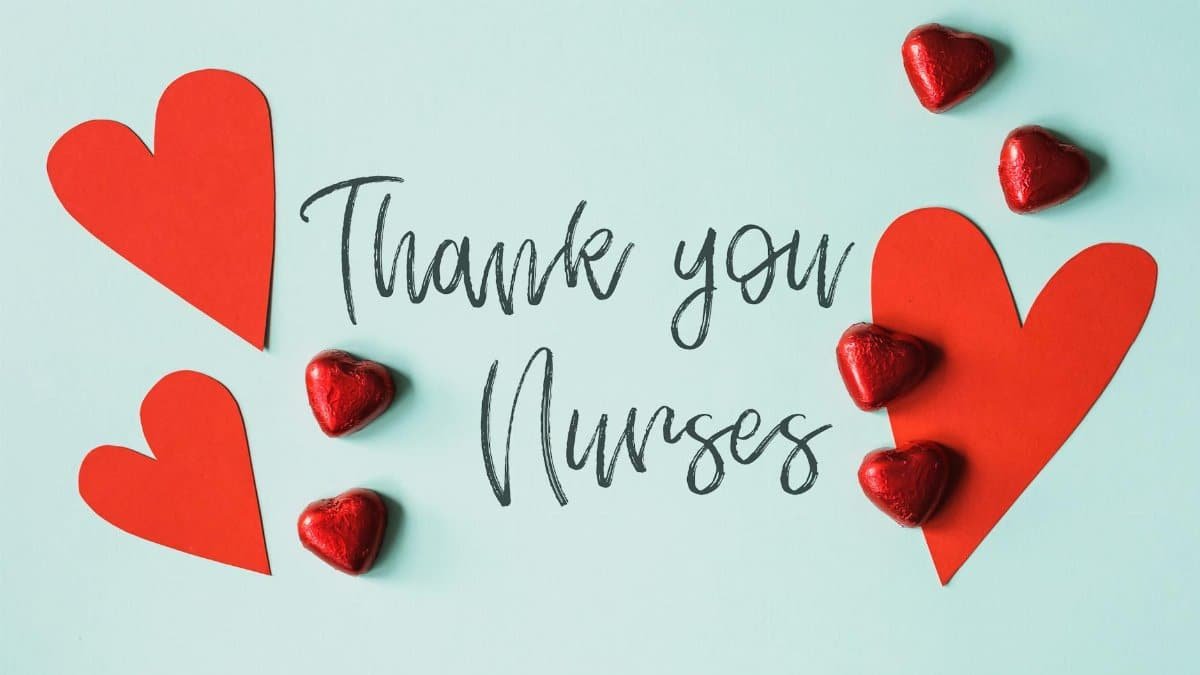 From above arrangement of red heart shapes placed on blue background with THANK YOU NURSES inscription