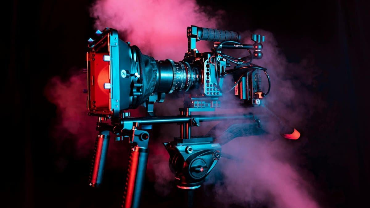 Professional camera rig with red and pink smoke, creating a dynamic visual impact.