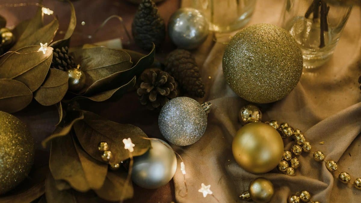 Elegant holiday decor with golden and silver glitter ornaments for festive celebrations.