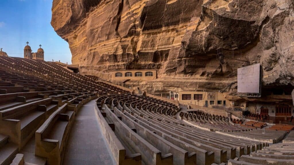 Panoramic view of St. Simon the Tanner Monastery's cave church seating area in Cairo, Egypt.