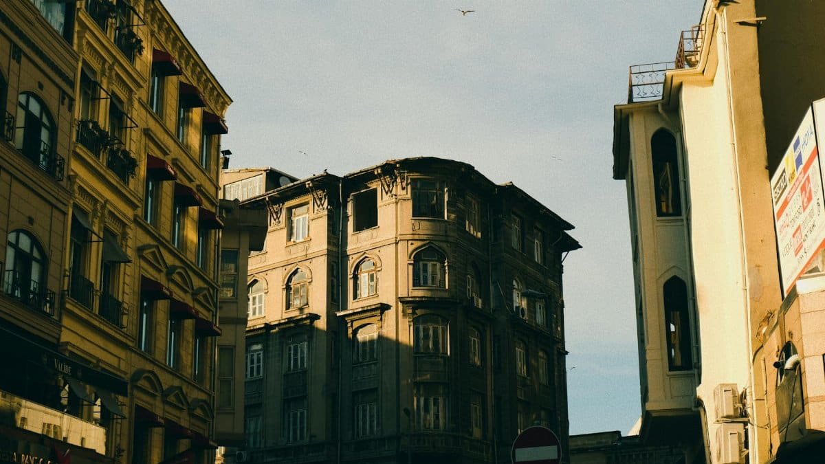 Captivating view of historic buildings in Istanbul under warm sunset light.