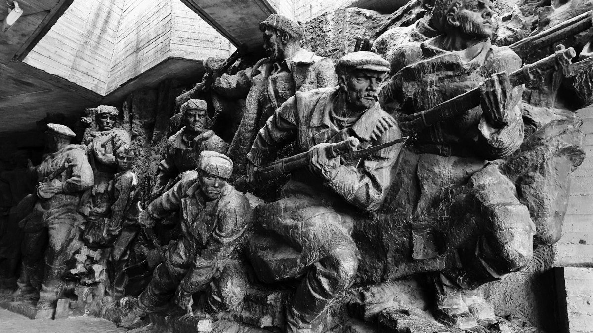 Black and white image of historical war monument depicting soldiers in Kiev, Ukraine.