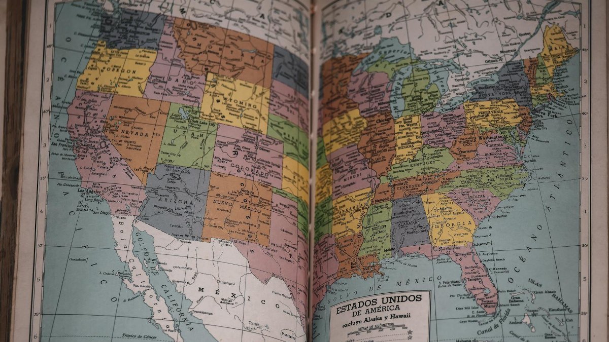 Classic vintage map of the United States in a historical book, showcasing detailed state borders.