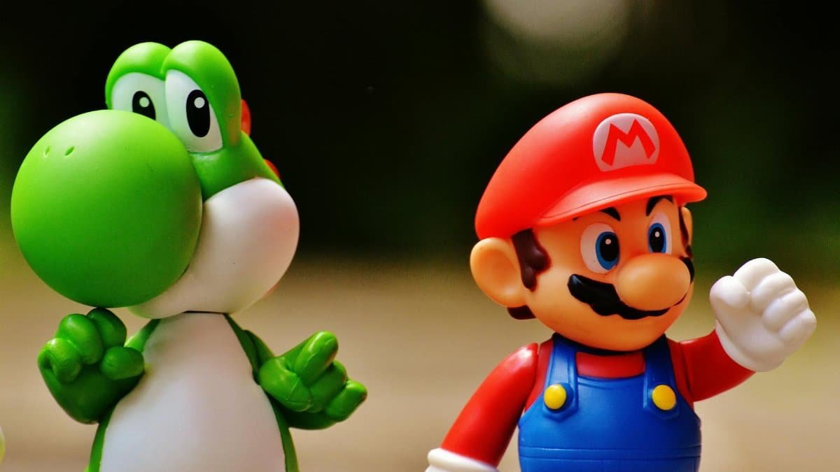 Detailed close-up of Mario and Yoshi figurines from a popular video game franchise.