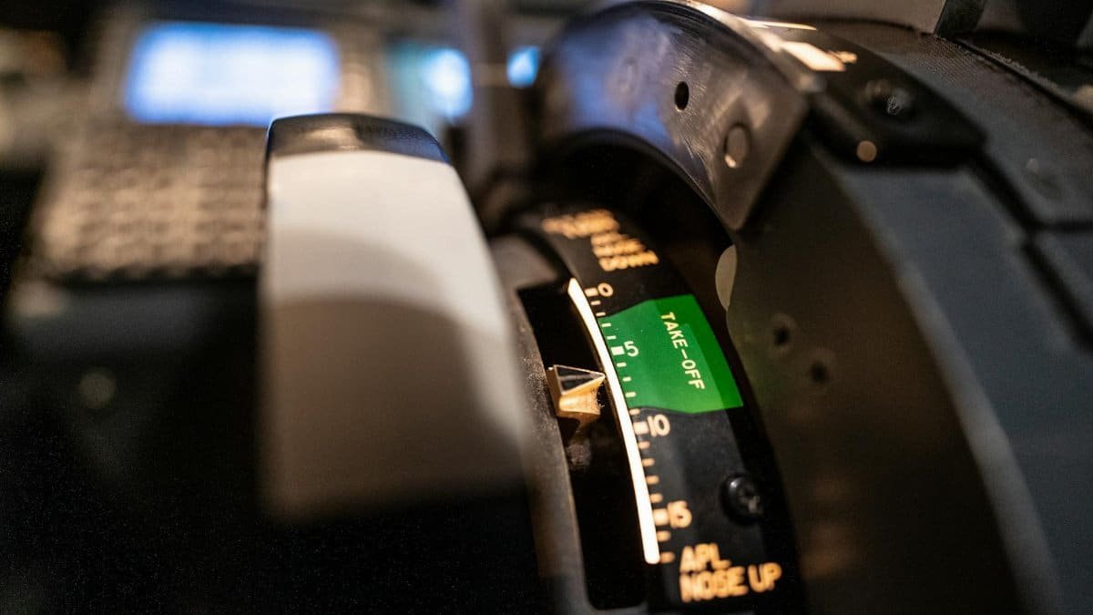 Detailed view of an aircraft throttle control panel in a cockpit, showcasing aviation technology.
