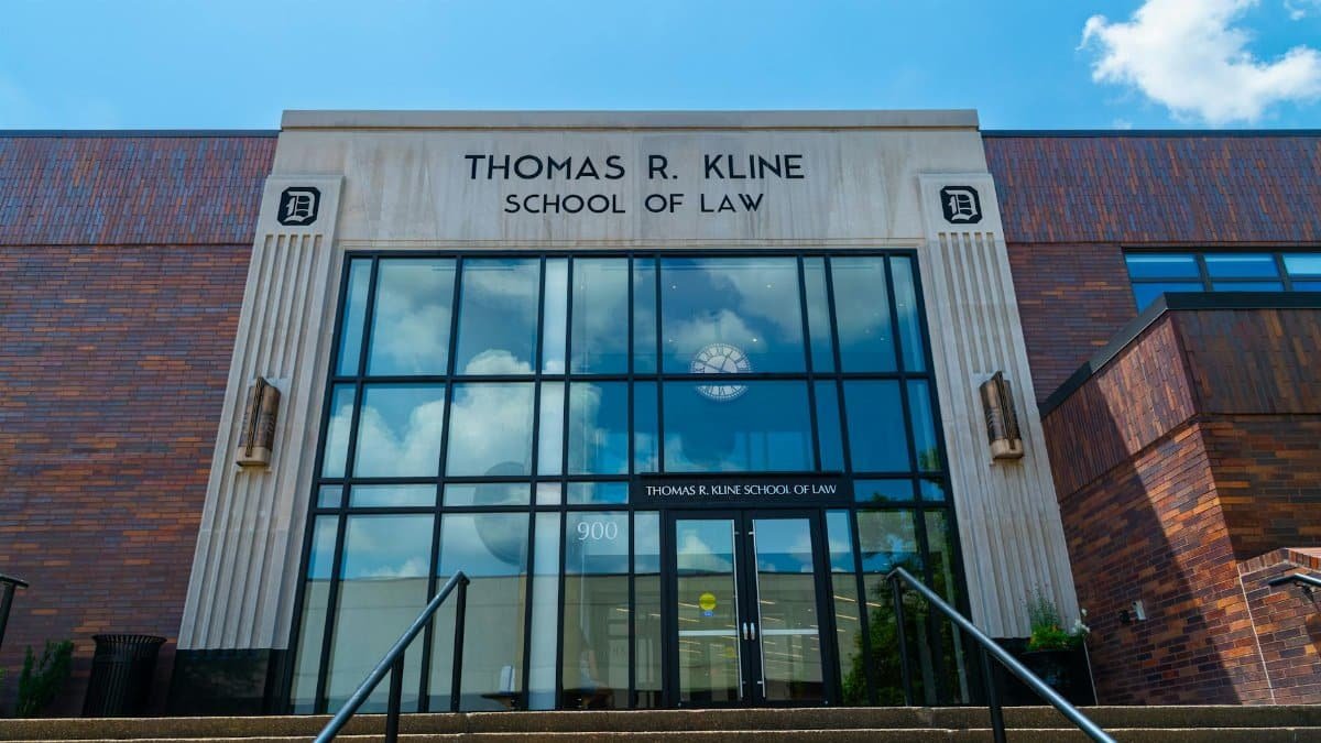 Front view of Thomas R. Kline School of Law building on a sunny day with clear sky.