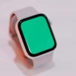 Smartwatch with a blank green screen displayed on a light background, suitable for mockups.