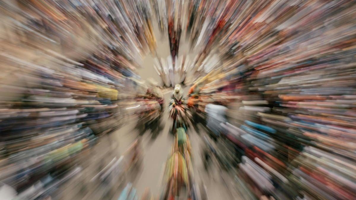 A dynamic aerial view of a bustling crowd with a zoom blur effect, showcasing movement and energy.