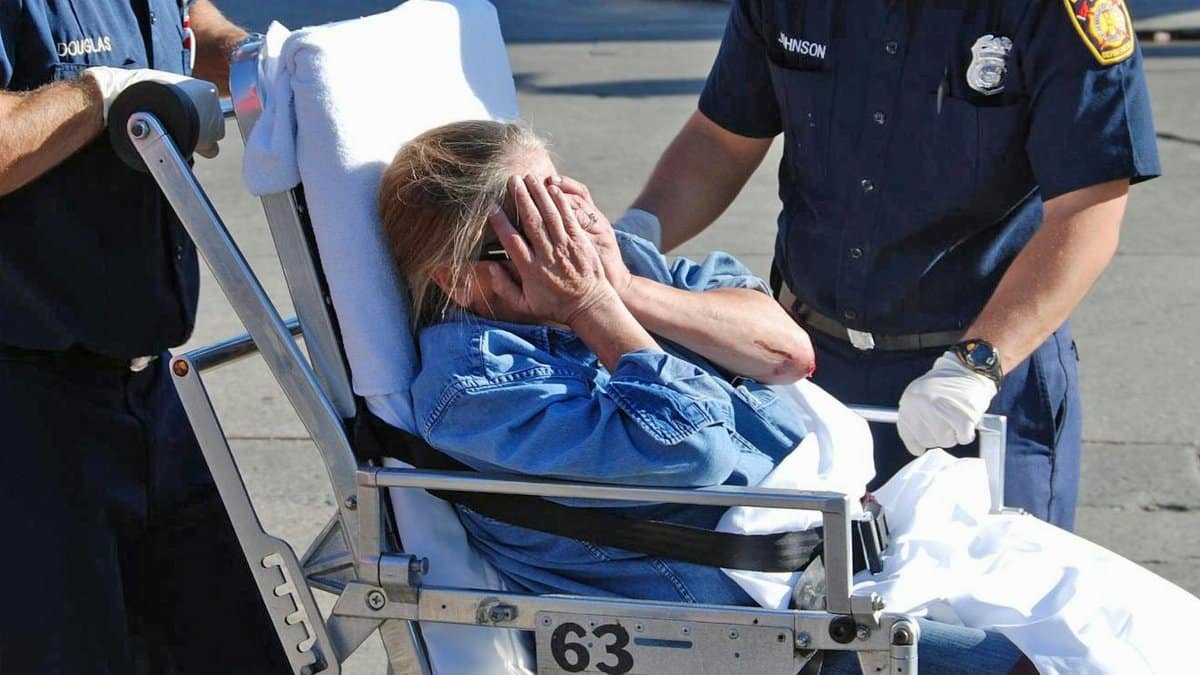 Ambulance crew assists a distressed woman during an emergency in Los Angeles.