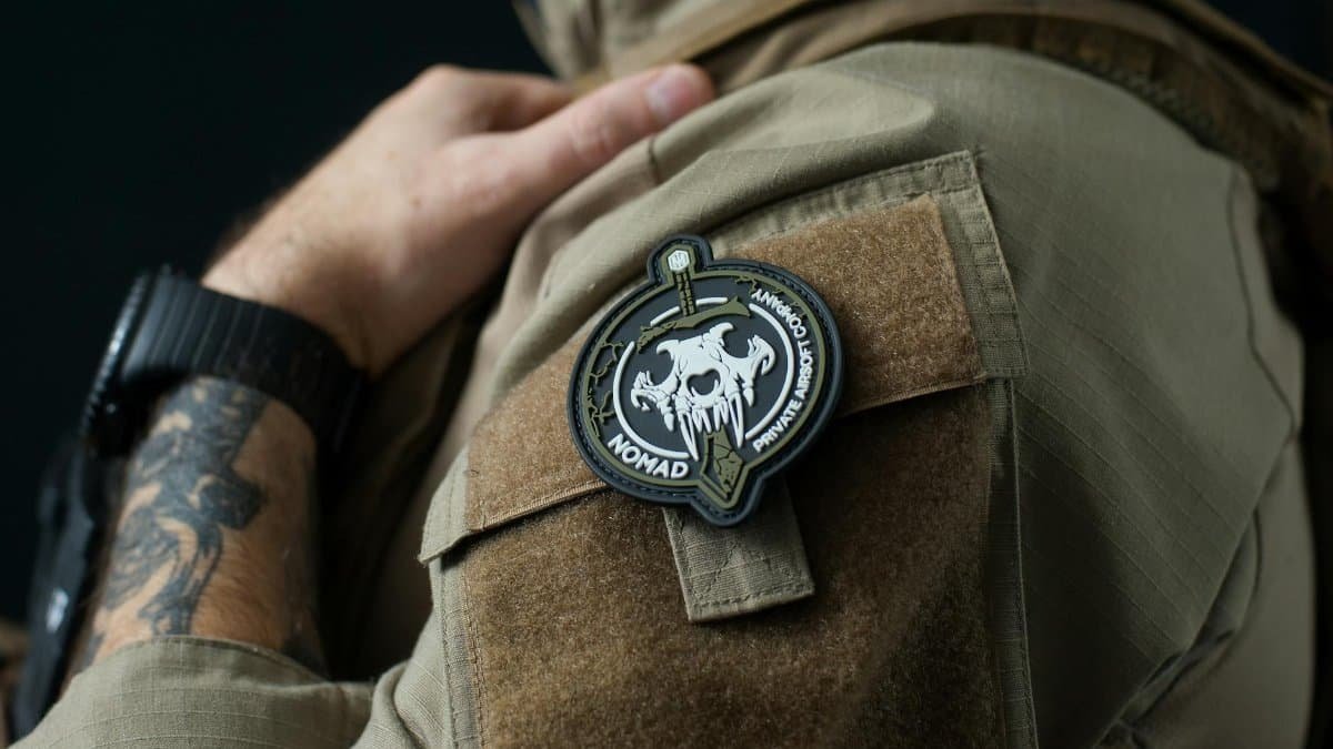 Detailed close-up of a tactical patch on a military uniform, showcasing design details and fabric texture.