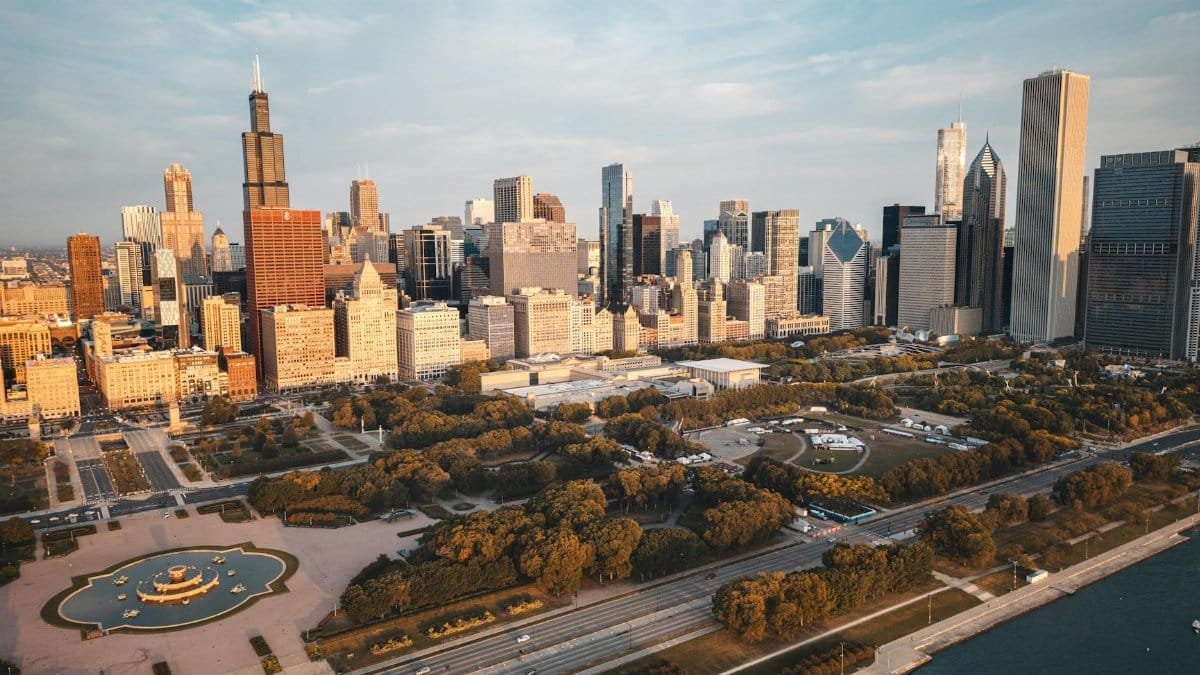 Stunning aerial view of the Chicago skyline with urban landscape and waterfront at dusk.