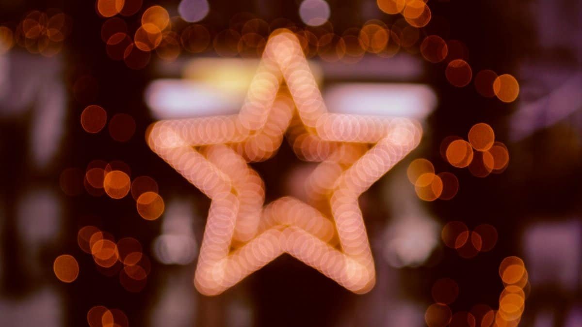 Star-shaped bokeh lights creating a warm and festive atmosphere.
