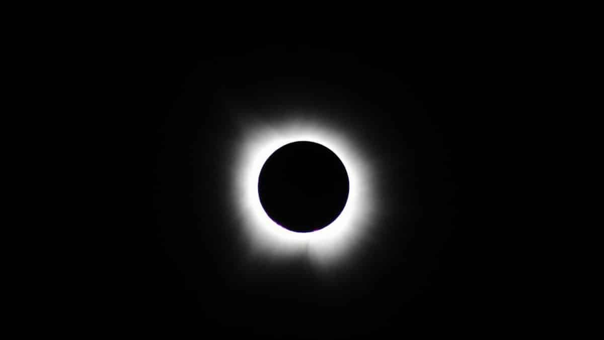 Stunning image of total solar eclipse showing the sun's corona against a dark sky.