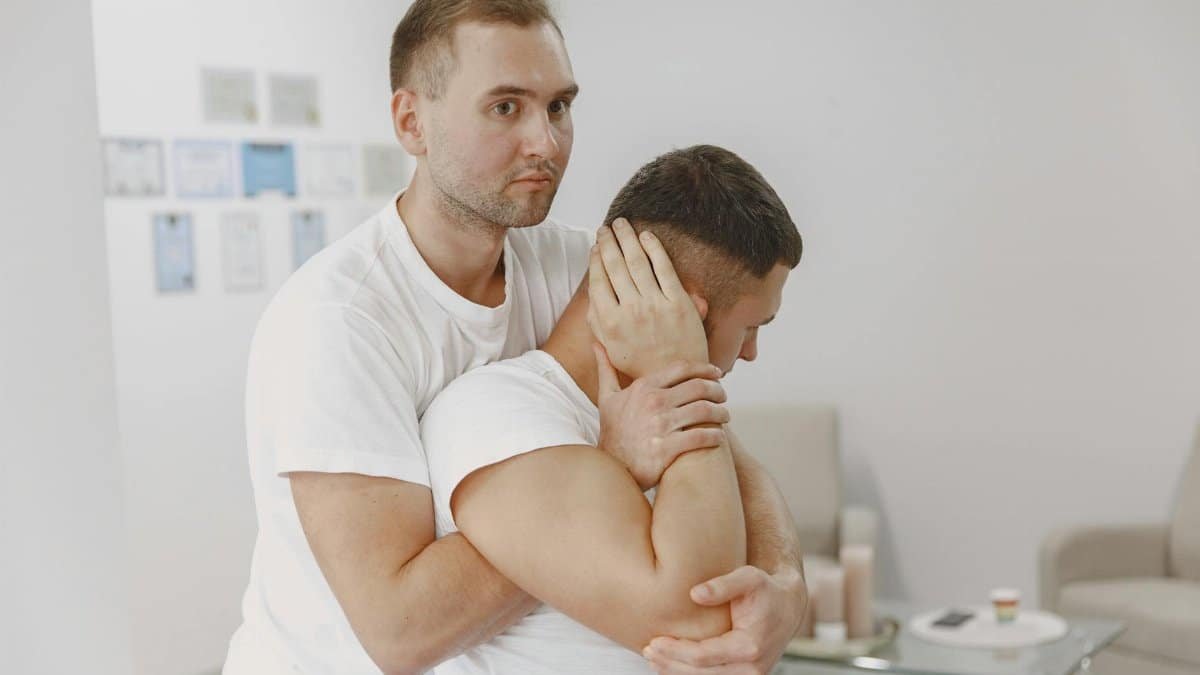 A professional massage therapist performs a relaxing massage therapy session indoors, promoting wellness and relaxation.