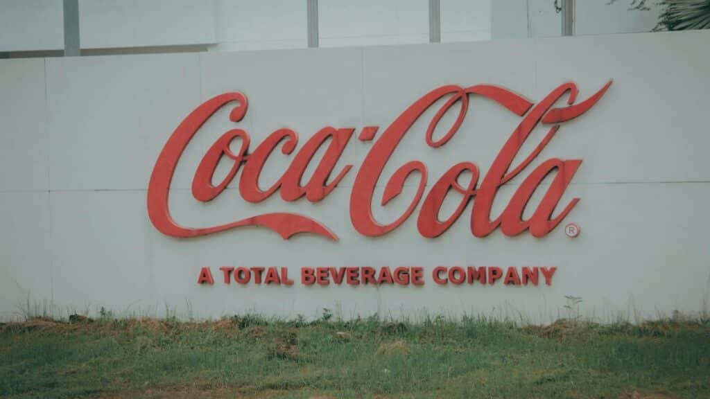 Image of Coca-Cola logo on outdoor signage, showing brand identity.