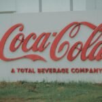 Image of Coca-Cola logo on outdoor signage, showing brand identity.