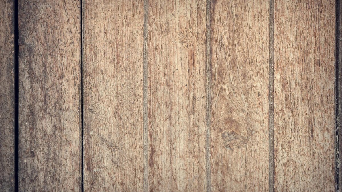 High resolution image of rustic wooden planks with rich natural texture and color variations.