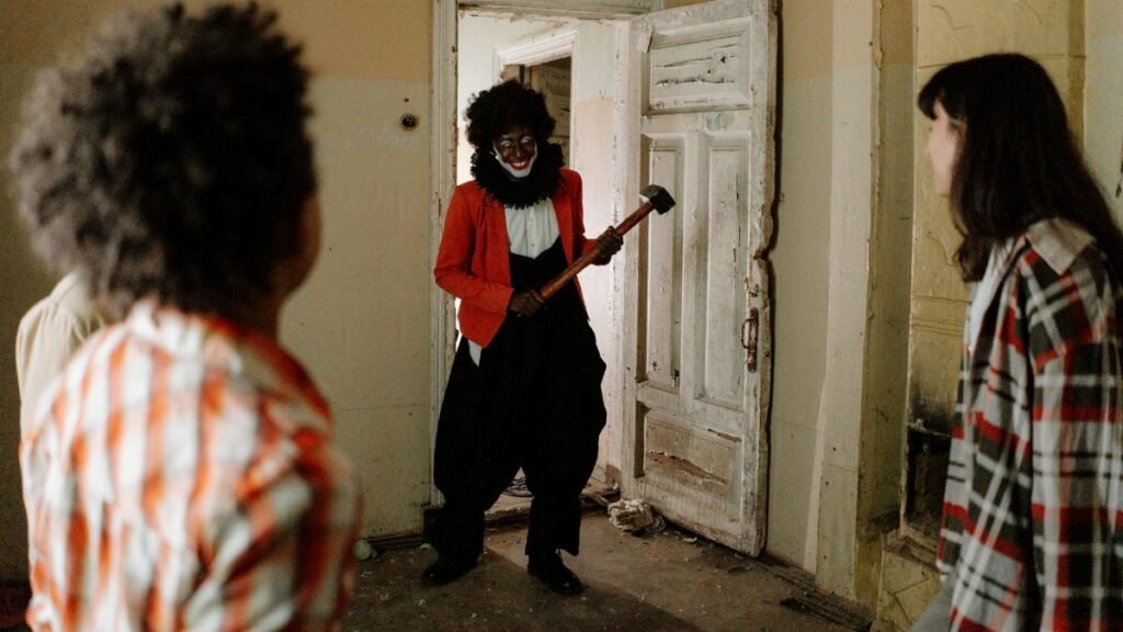 A frightening clown with an axe surprises friends exploring an abandoned building.