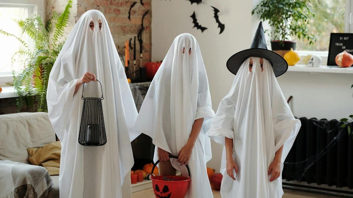 Creative homemade ghost costumes for a fun indoor Halloween celebration.