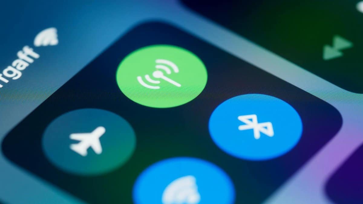 Detailed close-up image of a smartphone's control center showing various connectivity icons.