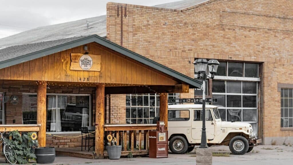 Explore a vintage cafe experience along Route 66 in Williams, Arizona featuring classic decor and a retro vehicle.