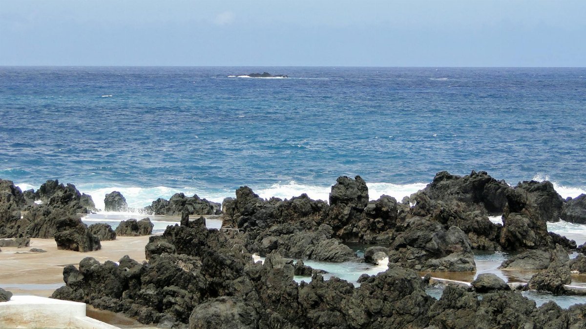 Explore the stunning volcanic pools and rugged coastal beauty of Porto Moniz on Madeira Island, Portugal.